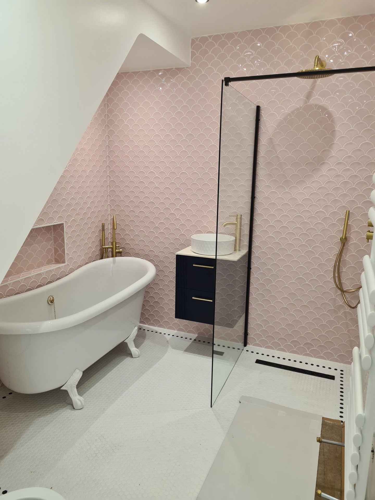 Bathroom renovation with clawfoot bath, glass shower screen and gold fittings